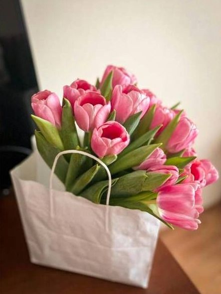 Student arranging a bouquet